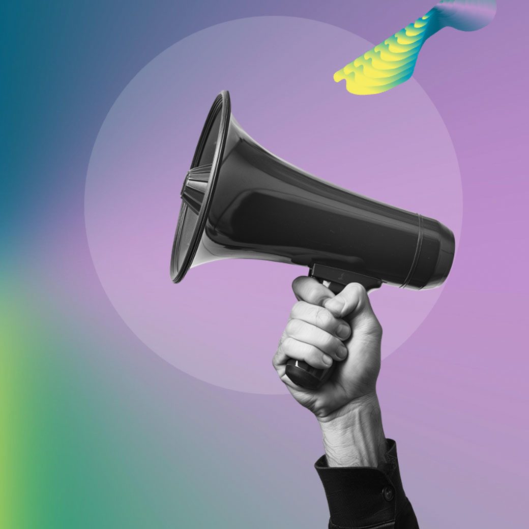 a hand holding a megaphone